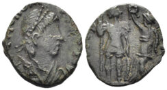 Honorius. 393-423 AD. AE4 (1.63g, 15mm). ‘Barbaric issue’. Victory crowning emperor